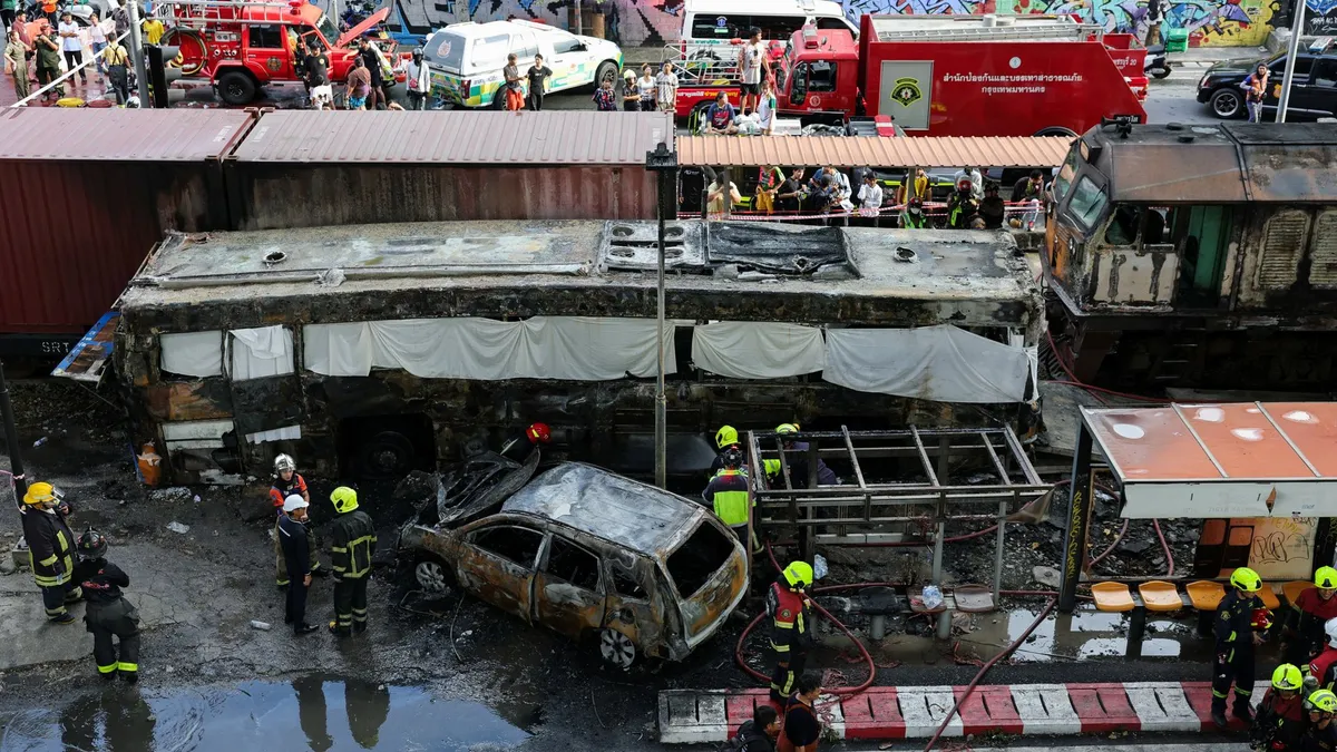 Freight train collides with bus in Bangkok, killing at least eight